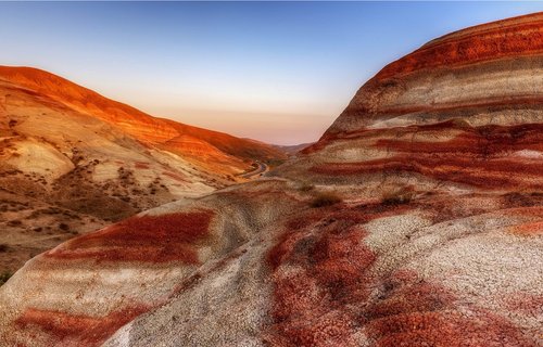 Prediction of Gamma Ray data from pre-stack seismic reflection partial angle stacks using Continuous Wavelet Transform and convolutional neural network approach